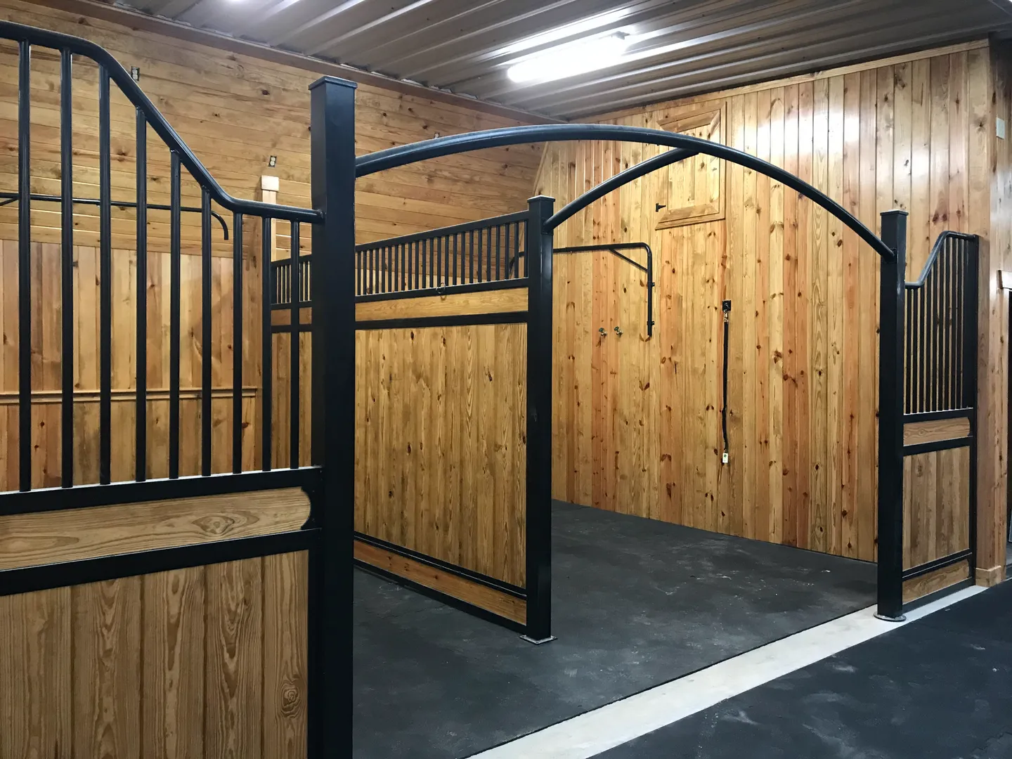 Horse stable with wooden walls